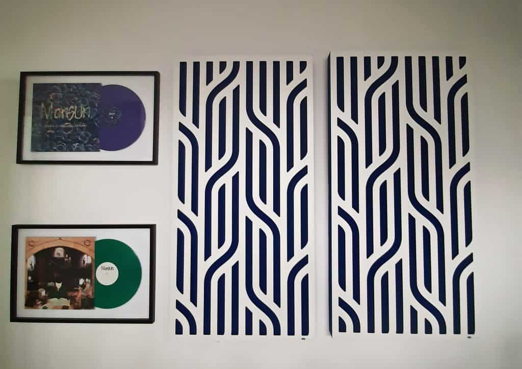 GIK Acoustic Impression Series Panels mounted on the wall next to two albums: Mansun's Attack of the Grey Lantern and SIX.