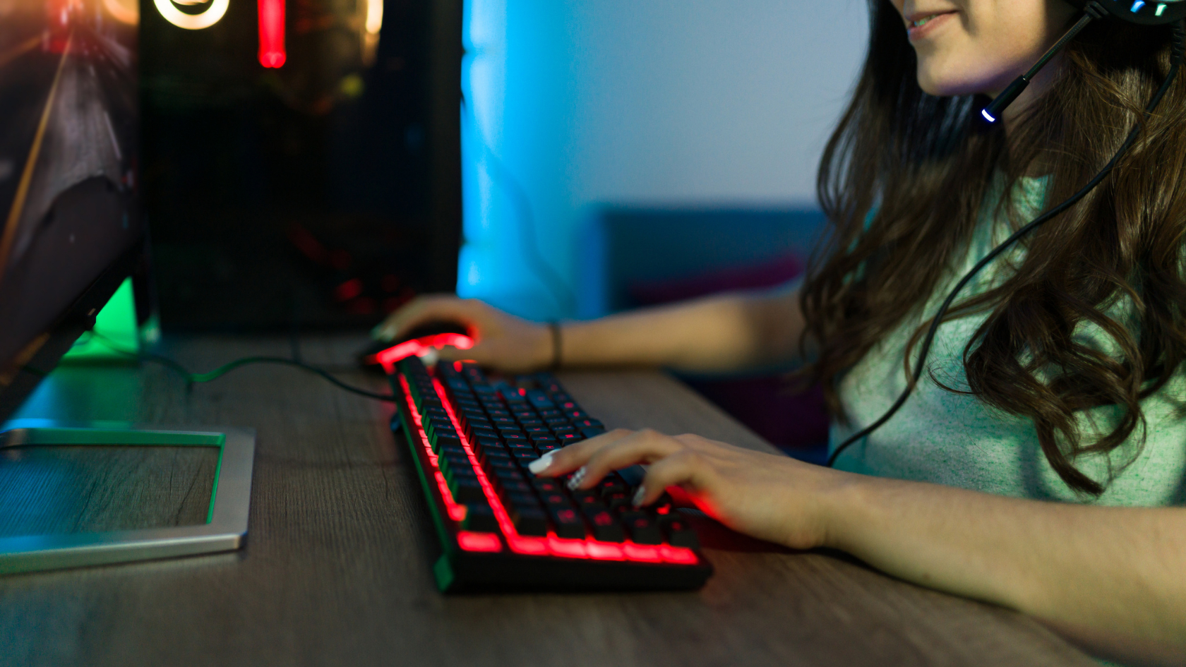 woman typing on gaming keyboard