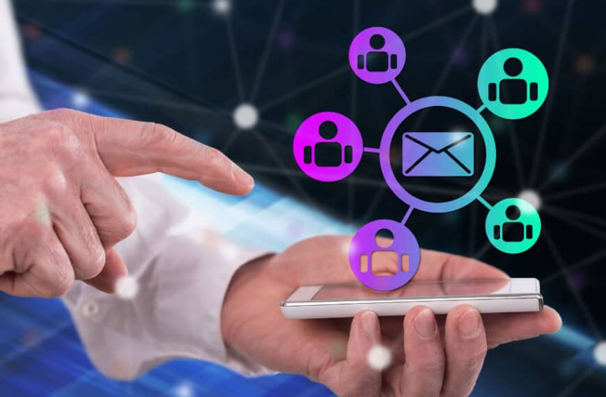 A person touches a smartphone displaying connected icons of people and an envelope, symbolizing communication or networking.