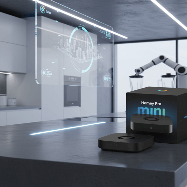 A smart home device and its box labeled "Homey Pro mini" are displayed on a modern kitchen island with digital screens and a robotic arm in the background.