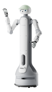 A white humanoid robot with a light green cap raises its right hand, appearing to wave.