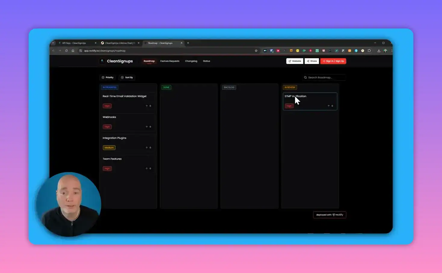 CleanSignups public roadmap with the 'STMP Verification' card highlighted in the In Review column and a cursor pointing to it; presenter overlay in lower-left.