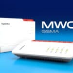 Two white FRITZ!Box routers with red accents are displayed on a blue gradient background with the text "MWC GSMA" beside them.
