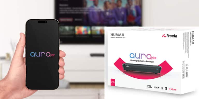 A hand holds a mobile displaying the Aura EZ logo; next to it is a Humax Aura EZ Ultra High Definition Recorder box on a white surface.